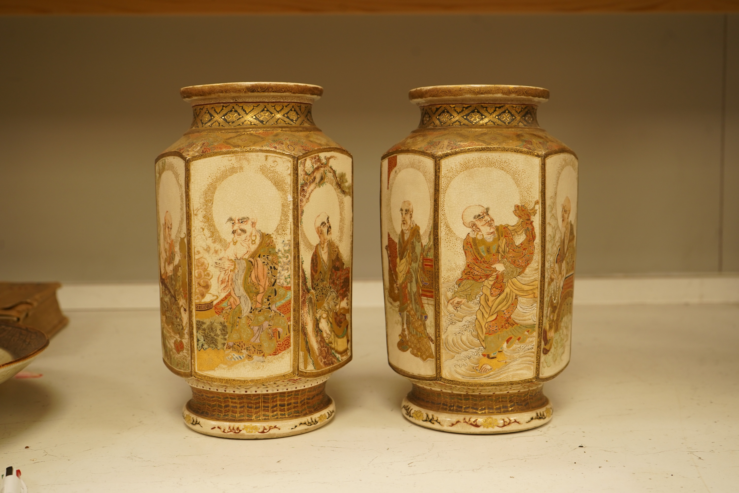 A pair of Japanese Satsuma 'rakan' vases, Meiji period, 26cm high